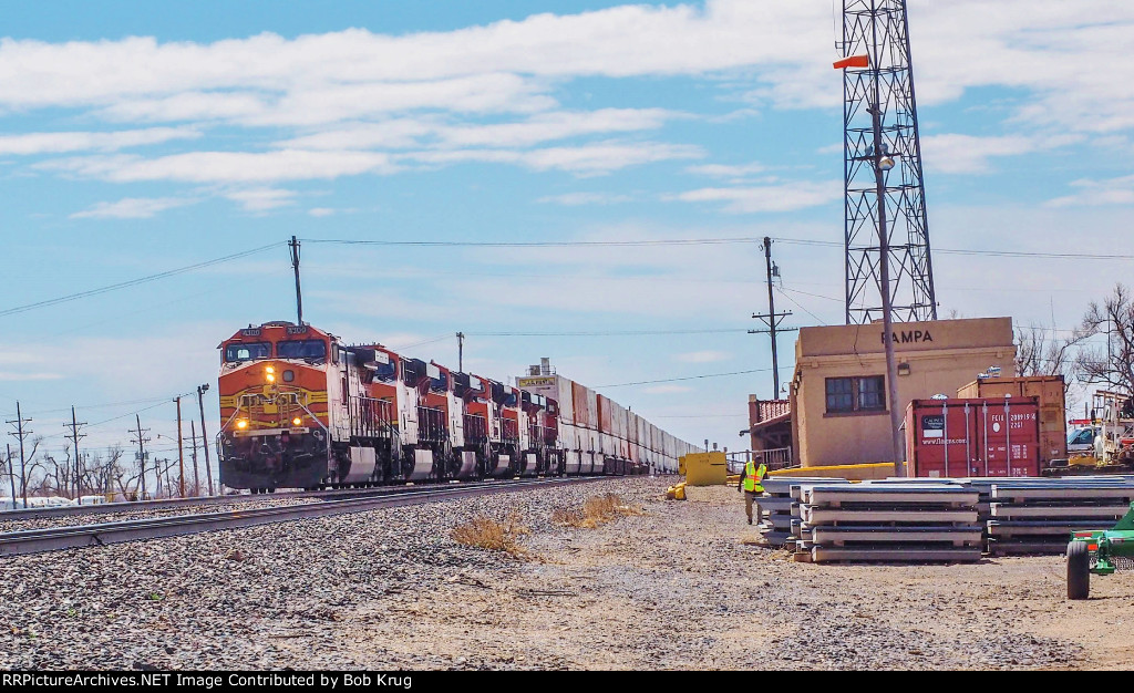 BNSF 4100 leads eastbound stacks past the ex-ATSF depot in Pampa, TX